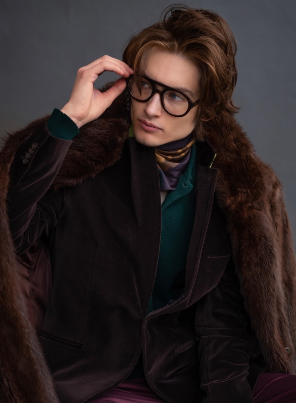 Brown velvet blazer layered under a fur-collared coat