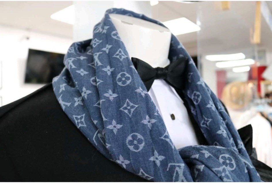 Louis Vuitton monogram scarf styled with a tuxedo and black bow tie