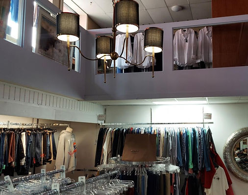 Shirts and jackets under the showroom chandelier